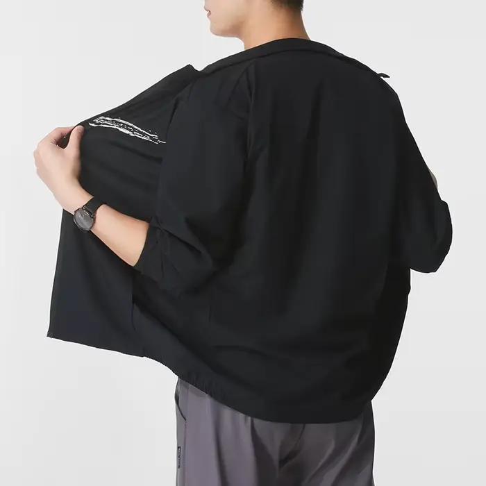 Nike Veste tissée coupe-vent à col montant pour hommes